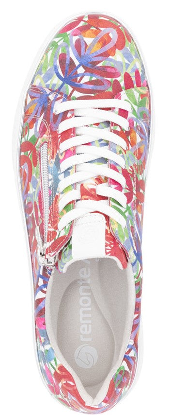 A floral sneaker with white laces and a zipper on the side.