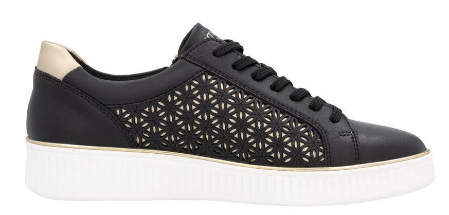 A black sneaker with floral cutouts and a gold heel.