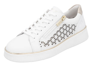 A white leather sneaker with a gold zipper and decorative cutouts.