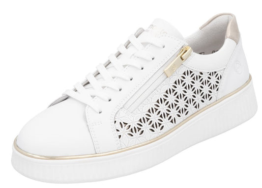A white leather sneaker with a gold zipper and decorative cutouts.