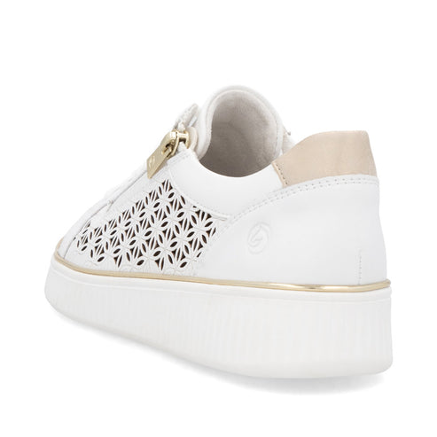 White leather sneaker with geometric laser cut design and gold trim.