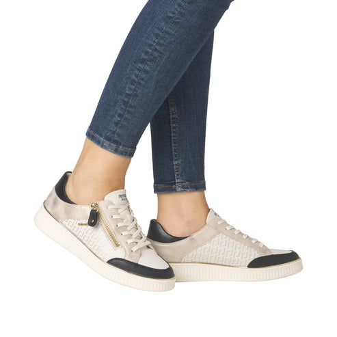 A pair of low-rise sneakers featuring black toe caps and heel counters, lace-up closure with an added zipper, and white soles.