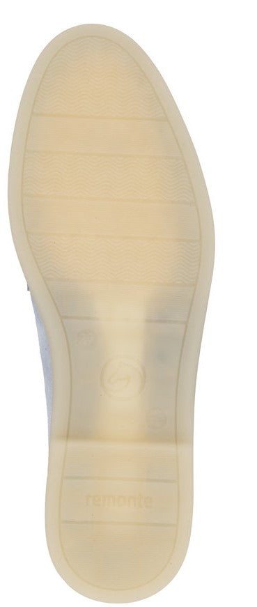 Beige shoe sole with linear pattern.