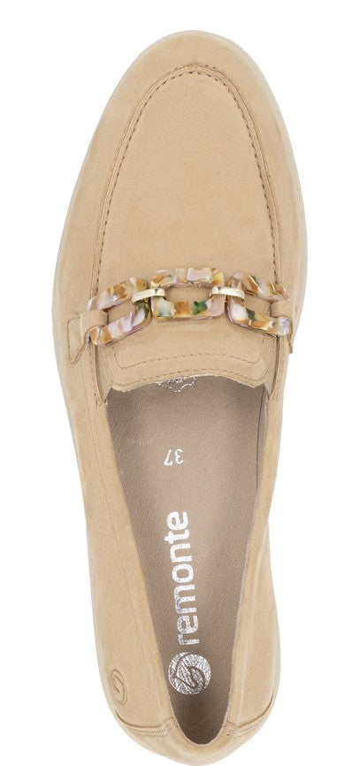 A beige loafer with a decorative chain.