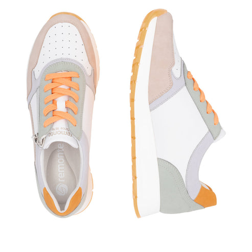 Pair of white, gray, and peach sneakers with orange laces and soles.