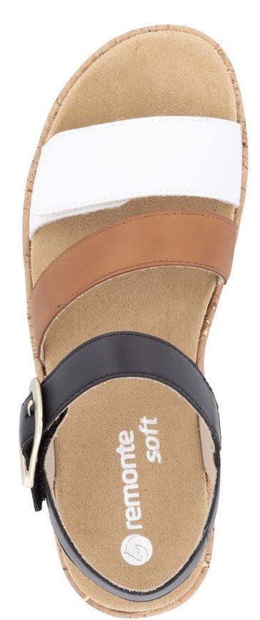 A sandal with white, brown, and black straps and a silver buckle, the sole says "remonte soft".