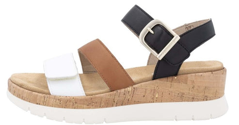 Cork platform sandal with white, tan and black straps and a buckle.
