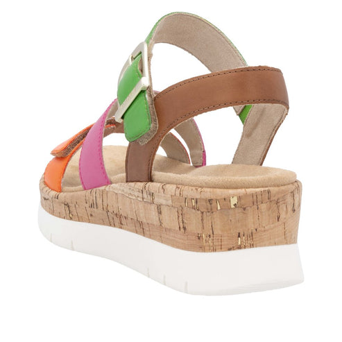 A women's sandal with orange, pink, green, and brown straps, with a buckle, a cork wedge, and a white sole.