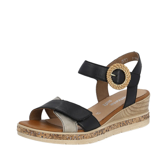 Black and silver sandal with a wedge heel and an adjustable strap.