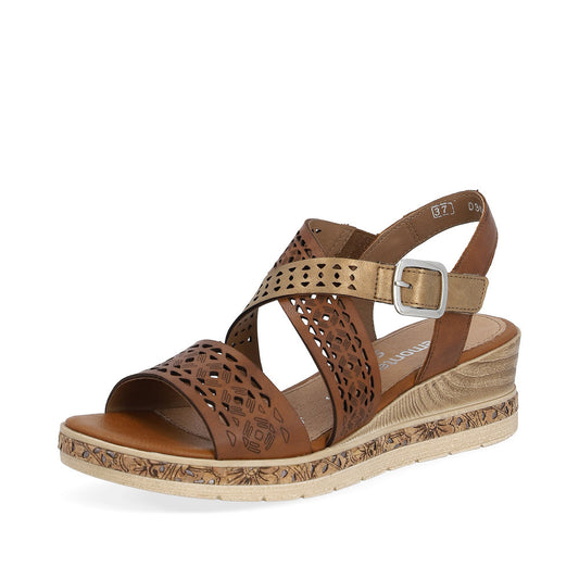 Brown sandal with laser-cut details, adjustable ankle strap, and low wedge heel.