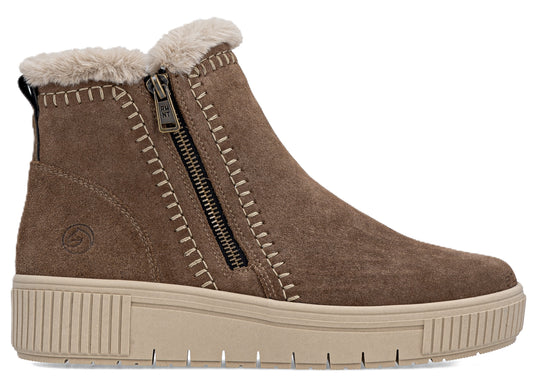Ankle-height, brown suede boot with faux fur lining and side zipper, atop a tan platform sole.