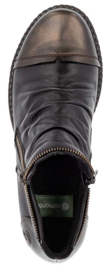A close up of a black leather boot with a metallic toe and zipper on the side.