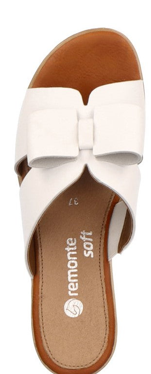 White sandal with bow. Interior text reads remonte soft.