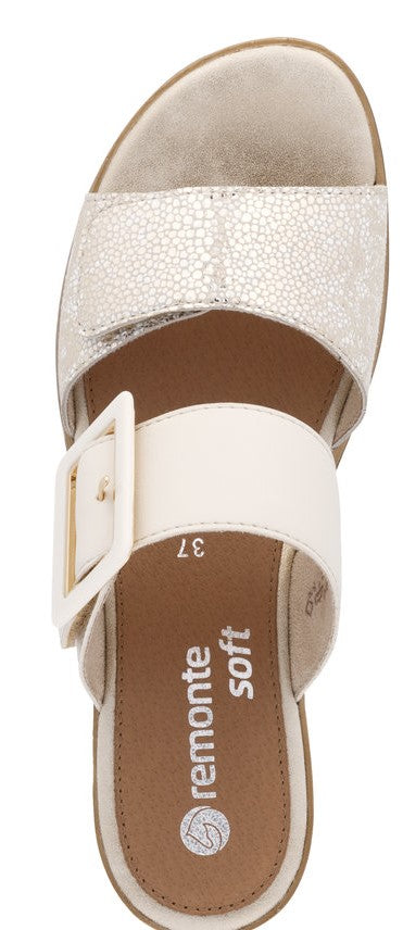 A sandal with two straps, one patterned and one plain, with a white buckle on the side.