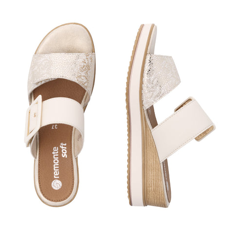 Two open-toed platform sandals, one showing the side with a wedge heel, both with two white straps, the upper strap patterned, with the word "remonte" visible on the sole of one sandal.