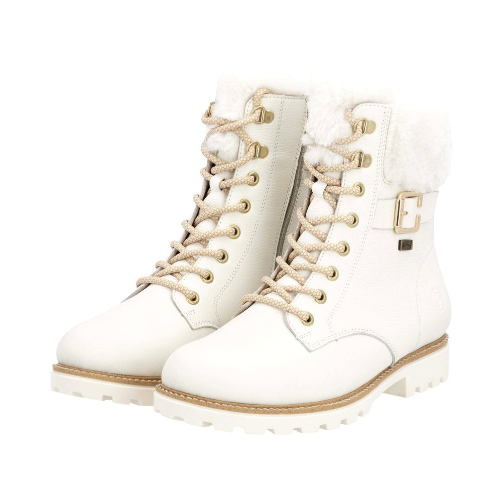 White lace-up boots with faux fur trim and buckle