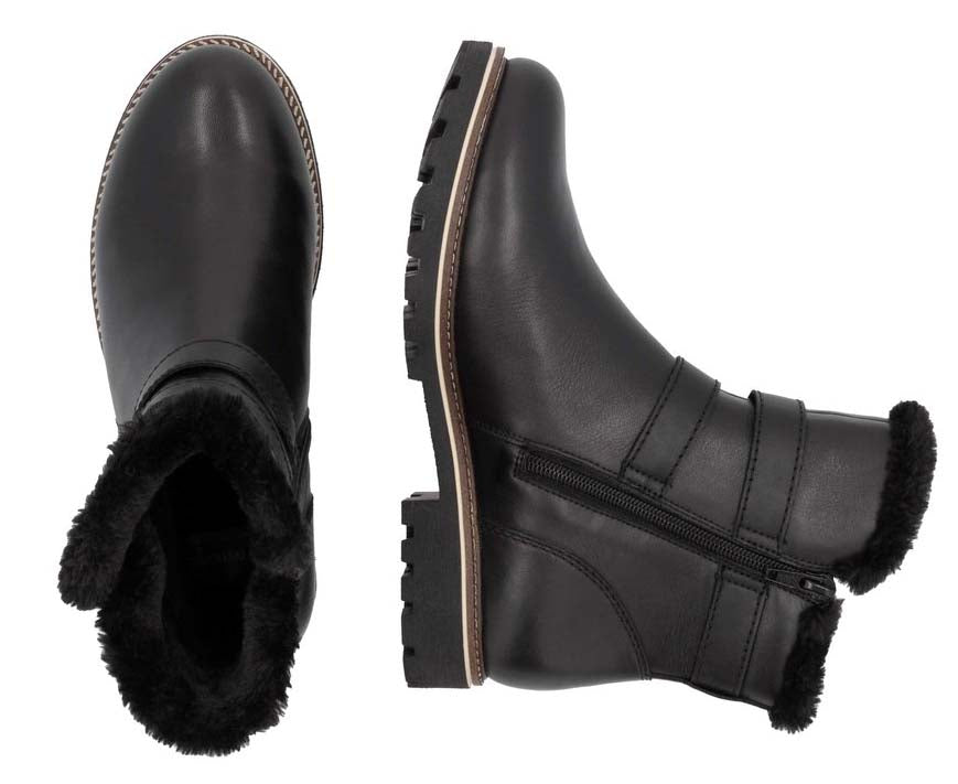 Two black leather ankle boots, one upright and one on its side, with faux fur trim and buckle detail.