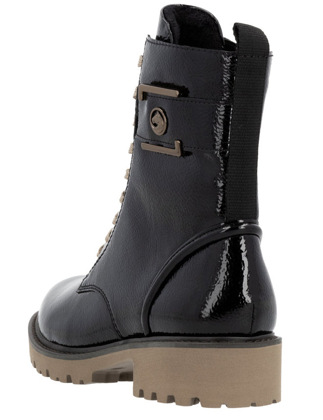 Black patent leather combat boot with a beige lug sole, a vertical stretch band on the heel, and metal buckles and eyelets.