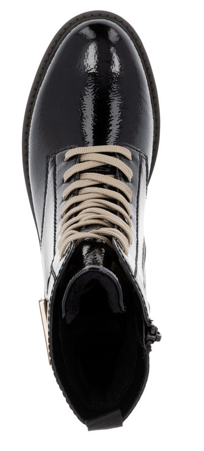 A high-angle view of a black patent leather boot with light tan laces.