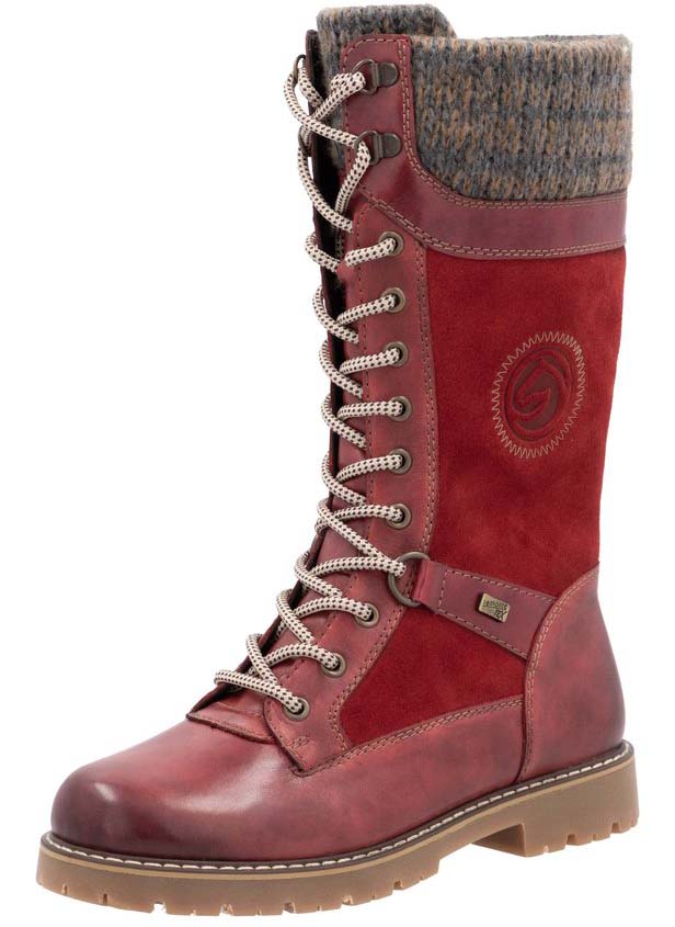 Knee-high red leather lace-up boot with decorative knit cuff.