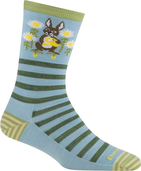 A light blue crew sock featuring horizontal dark green stripes, a light green cuff, and a graphic of a brown rabbit holding a yellow egg while riding a skateboard amongst white daisies.