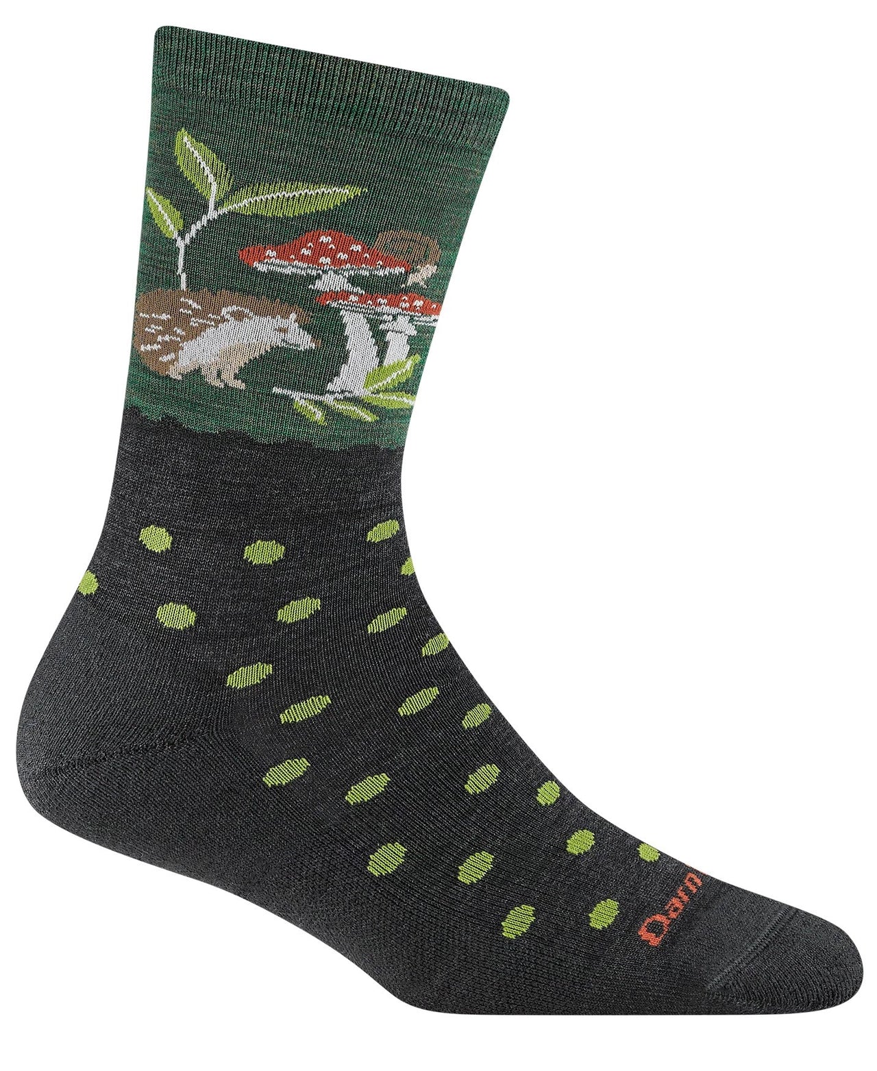 A dark gray crew-length sock featuring a green cuff with a forest-themed pattern of a hedgehog, red and white mushrooms, and leaves, with lime green polka dots covering the foot and heel.