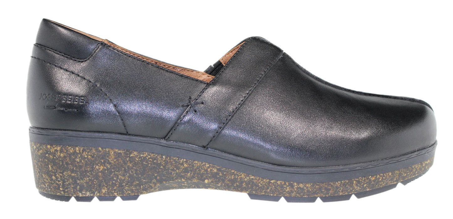 A black, leather, slip-on shoe with a cork wedge heel.