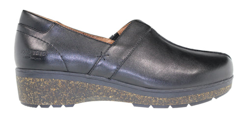A black, leather, slip-on shoe with a cork wedge heel.