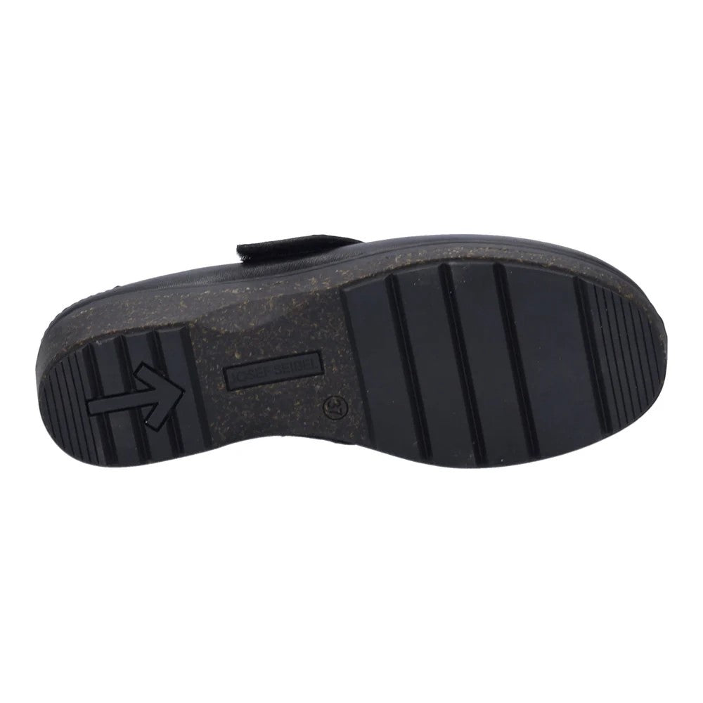 Black shoe sole with arrow pointing left and ribbed pattern.