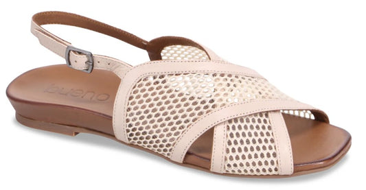 Beige leather flat sandal with criss-cross straps and slingback strap.