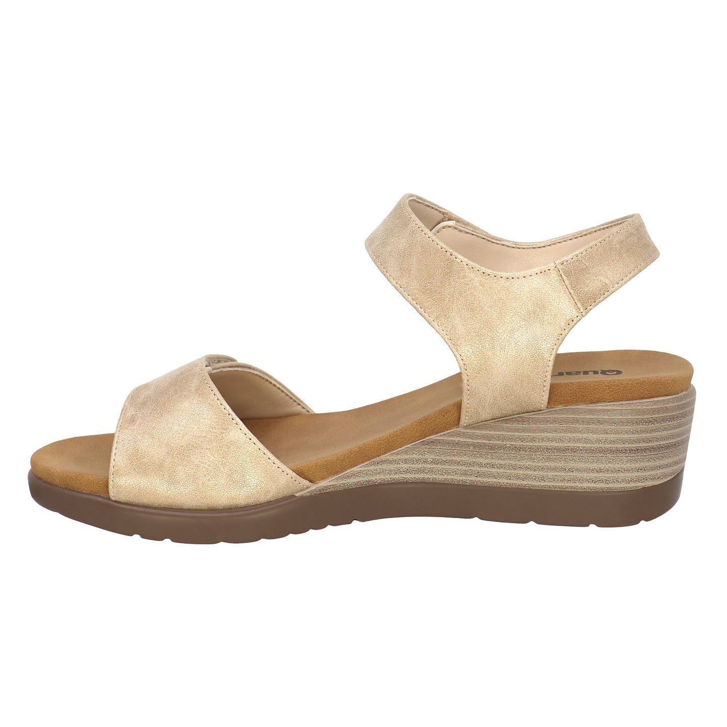 Gold wedge sandal with ankle strap and low heel.