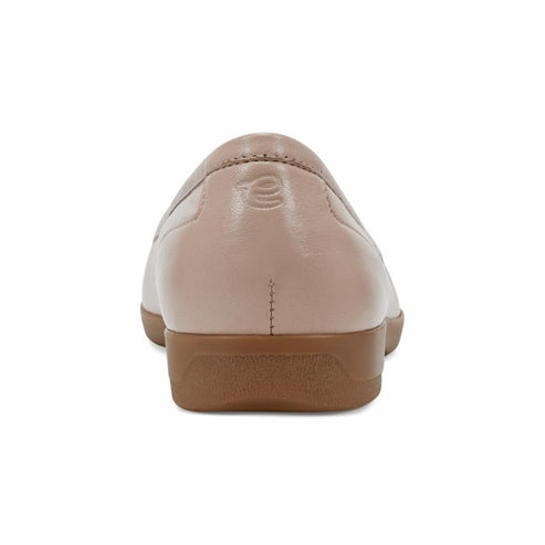 Beige slip-on shoe, back view.