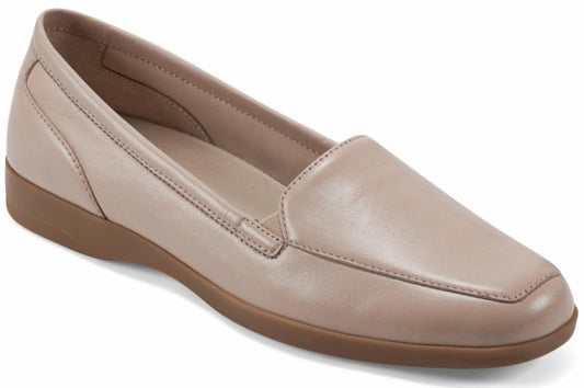 Beige leather loafer with a flat, brown sole.