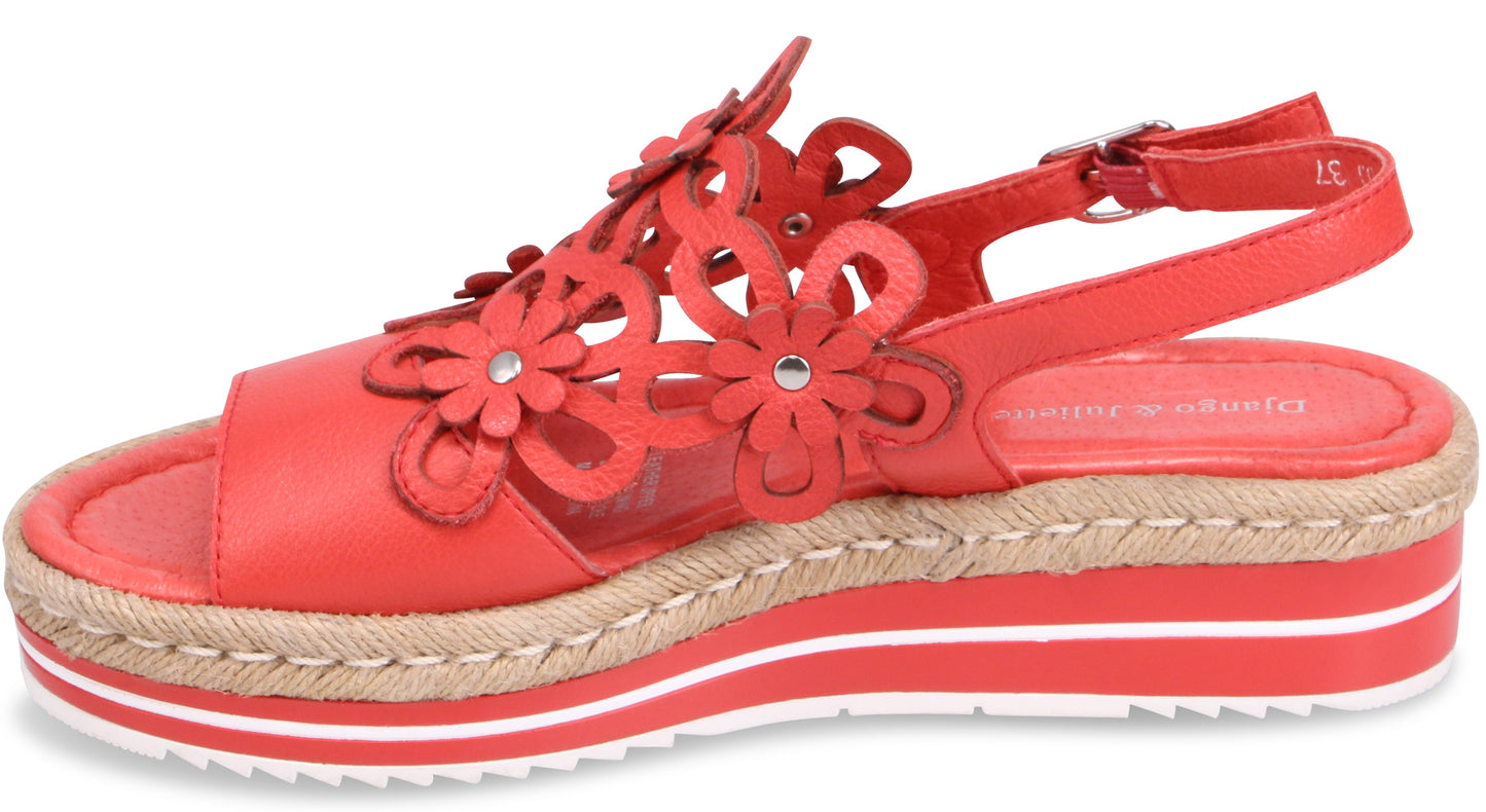 Red sandal with decorative flower accents, espadrille midsole, and buckled ankle strap.
