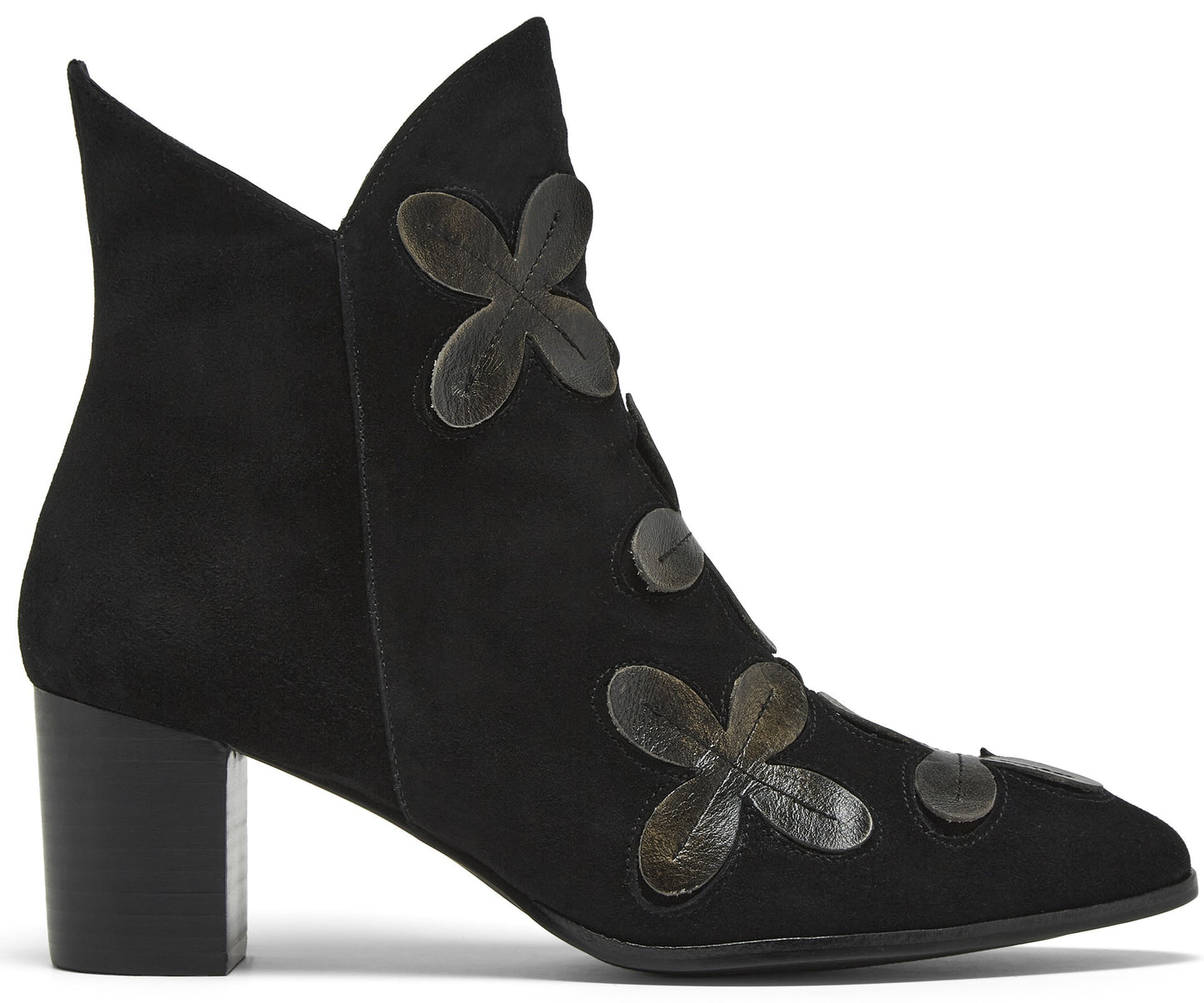 A black suede ankle boot with a block heel, featuring a pointed toe and decorative dark grey leather floral appliqués along the front seam.
