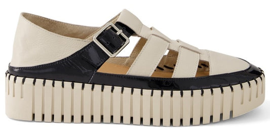 A fisherman sandal featuring a platform sole, a grid-like upper design, and a buckled ankle strap.