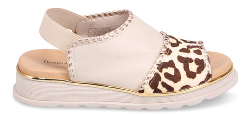 A sandal with a beige upper and a leopard print toe.