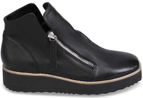 A black leather ankle boot with a side zipper closure, a rounded toe, and a thick, textured black sole with a light beige trim.