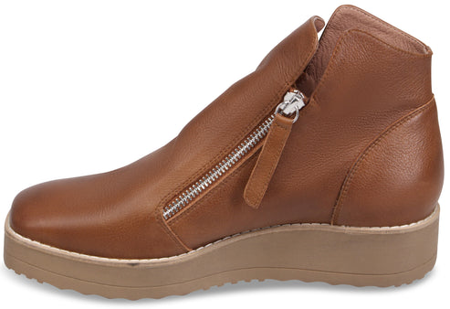 A brown leather ankle boot with a side zipper and a thick, ridged light brown platform sole.