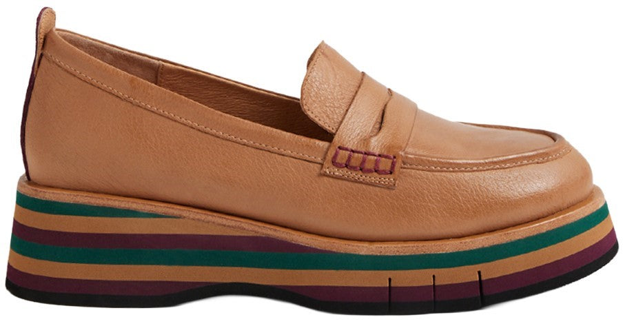 A tan leather loafer with a thick platform sole featuring alternating horizontal stripes in tan, teal, and deep maroon.