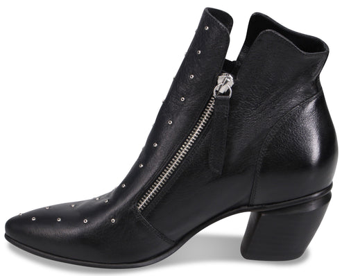 A black leather ankle boot with a pointed toe, a chunky mid-height block heel, a silver side zipper, and small silver stud accents along the vamp and shaft.