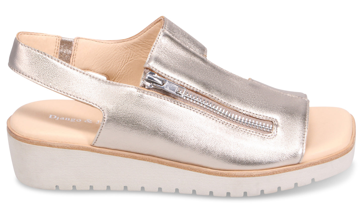 Silver sandal with zipper detail and slingback strap.