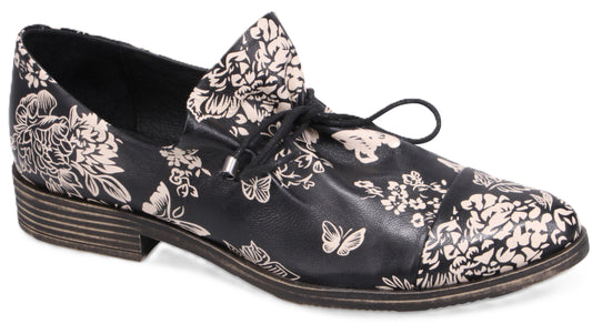 Black floral patterned women's leather shoe with shoelaces.