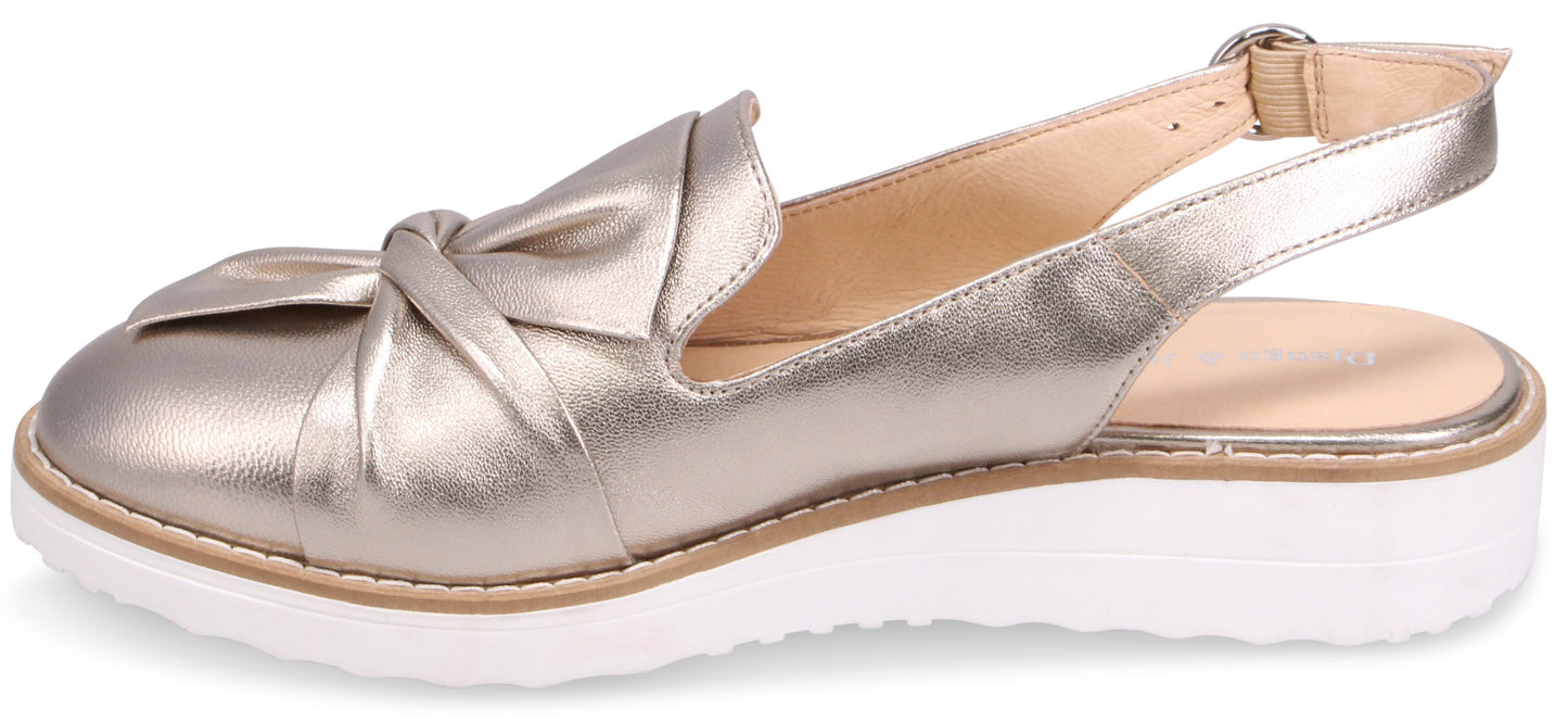 Gold slingback shoe with bow accent and white sole.