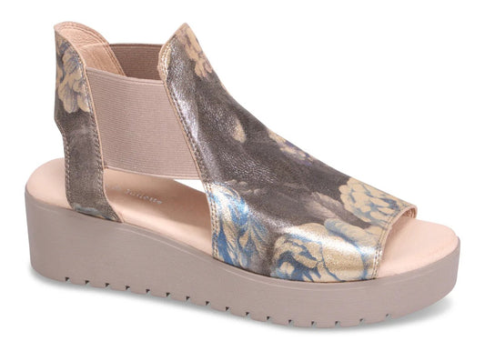 Open-toe platform sandal with floral pattern and elastic ankle strap.