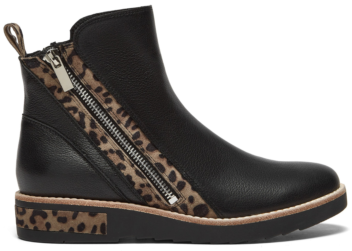 A black ankle boot with a textured leather upper, featuring an asymmetric side zipper framed by a leopard print accent, and a black sole with a leopard print detail on the heel.