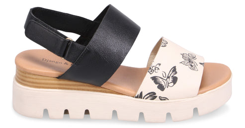 Platform sandal with black elastic back strap and butterfly printed front strap.