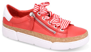 Red leather sneaker with white heel accent, cork midsole, white sole, zipper detail, and red and white striped laces.