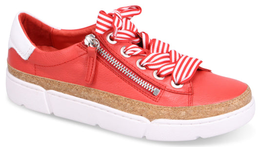 Red leather sneaker with white heel accent, cork midsole, white sole, zipper detail, and red and white striped laces.