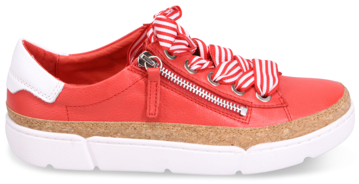 Red leather sneaker with white accents, ribbon laces and a decorative zipper.